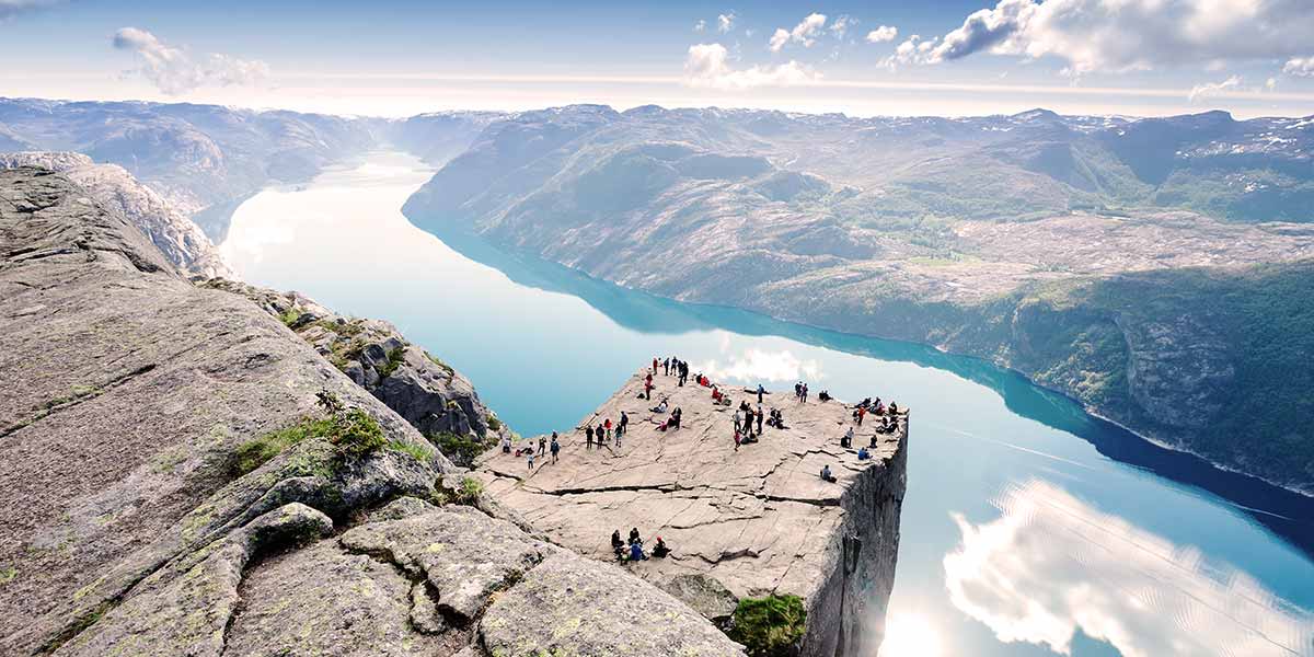 Tourists on Preikestolen with view on the Lysefjord