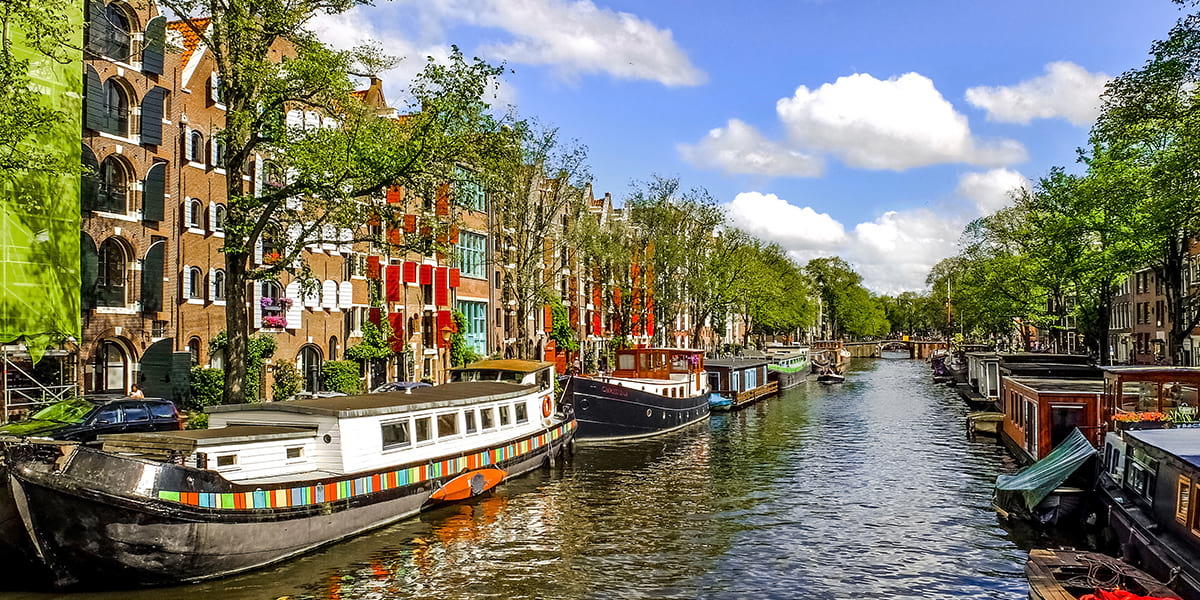 Amsterdam boats on a canal Amsterdam Canal