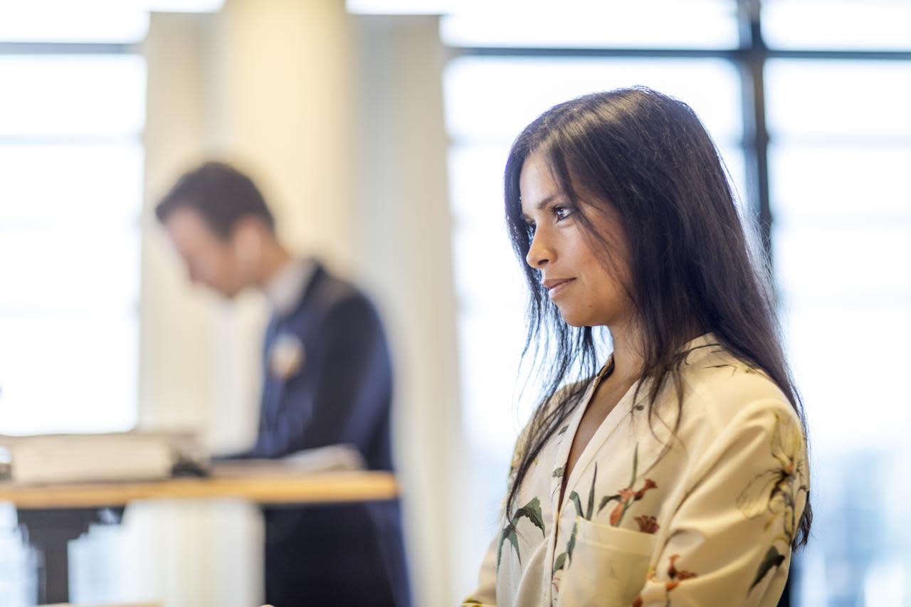 A DFDS employee works at her desk caring employer