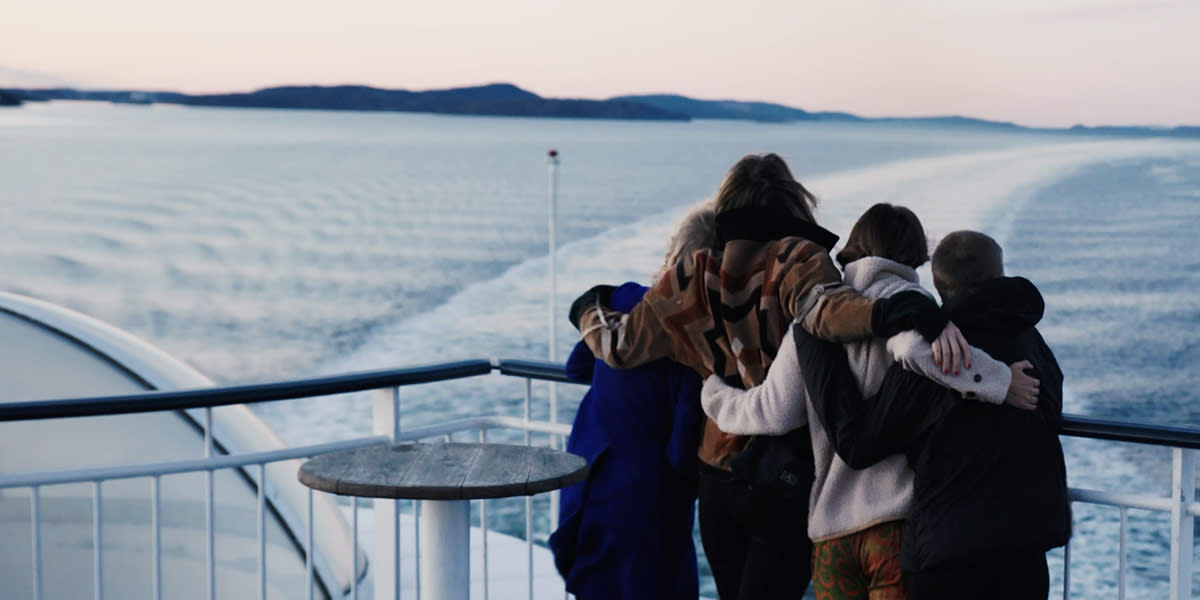 A family hugging onboard Hero A family hugging onboard Hero