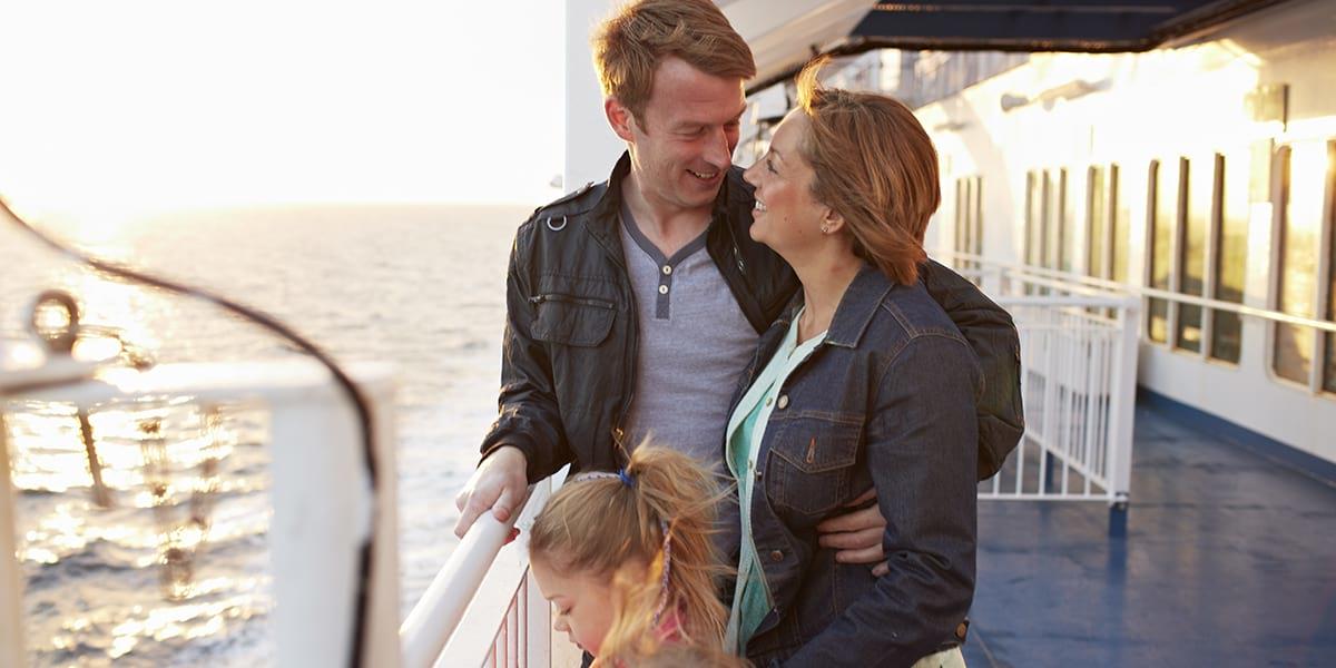 Young family on the deck of a DFDS ferry at sunset Family on deck at sunset