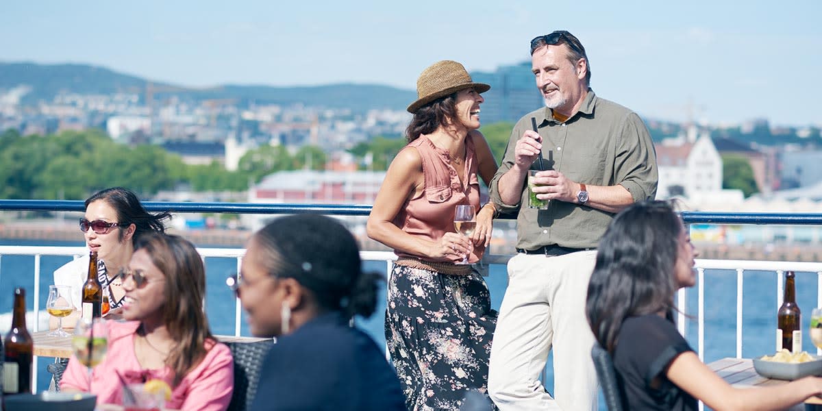 A couple enjoying drinks together at the sky bar Sky bar onboard Newcastle-Amsterdam