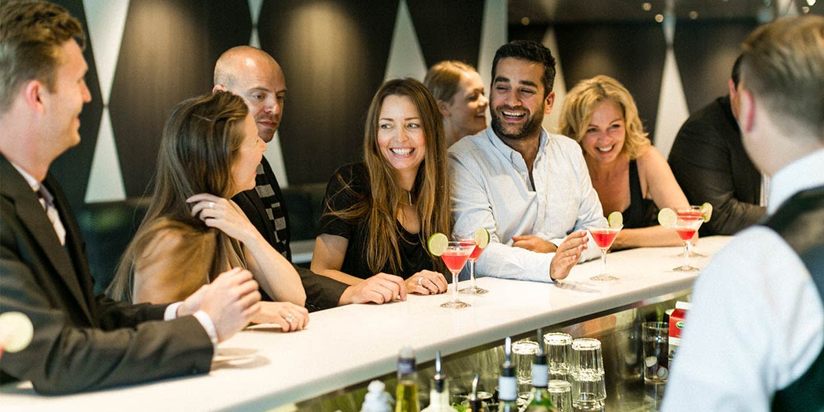 A group of friends in the bar onboard Copenhagen-Oslo Friends in the bar onboard