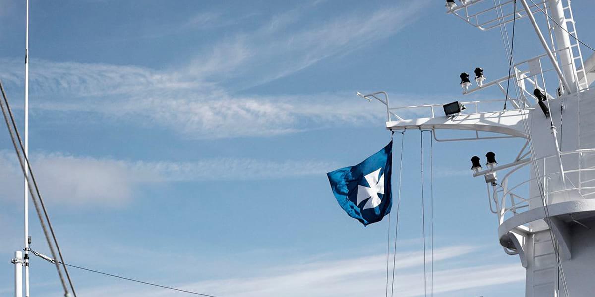 A DFDS flag blowing in the wind on one of the ships DFDS flag